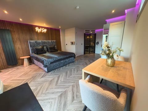 Bed, Living room, Seating area, Dining area