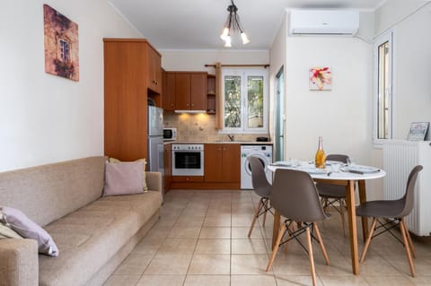 Kitchen or kitchenette, Living room, Seating area, Dining area, oven, stove, washing machine, air conditioner