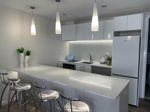 Kitchen or kitchenette, dishwasher, oven, stove