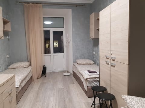 Bed, Photo of the whole room, Decorative detail, Bedroom, microwave, storage, towels