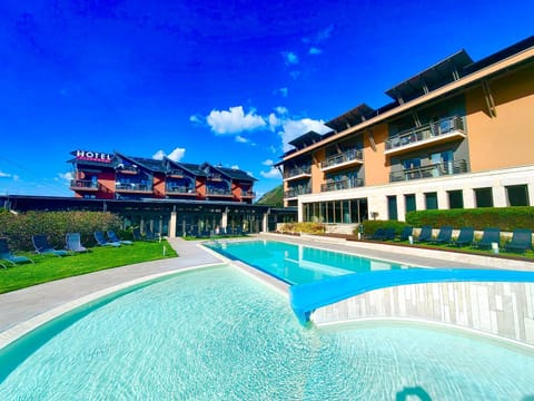 Property building, Day, Property logo or sign, Beach, Pool view, Swimming pool, Swimming pool, sunbed