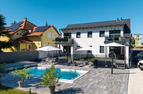 Property building, Pool view, Swimming pool, sunbed