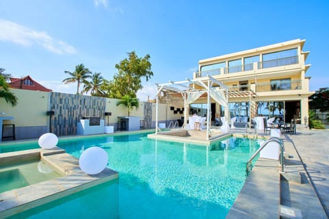 Property building, Day, Pool view, Swimming pool, sunbed
