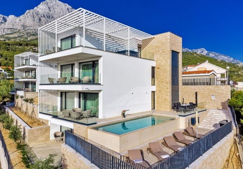 Property building, Patio, Day, Natural landscape, Summer, Garden, Sauna, Balcony/Terrace, Balcony/Terrace, Seating area, Beach, Mountain view, Pool view, Sea view, Swimming pool, Swimming pool, sunbed