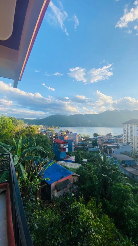 Property building, Day, Natural landscape, City view, Lake view, Mountain view
