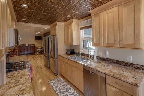 Kitchen or kitchenette, dishwasher, oven, stove