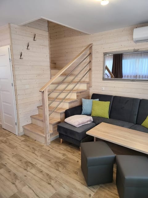 Property building, Living room, Seating area, air conditioner