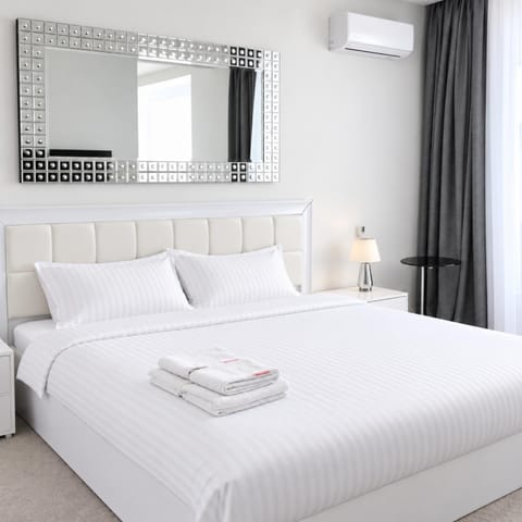 Bed, Photo of the whole room, Bedroom, towels, air conditioner
