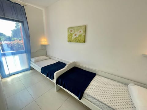 Relax by the garden-flat for up to 6 guests Apartment in Porto Santa Margherita