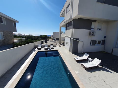 Property building, Patio, Swimming pool