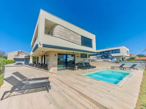 Property building, Pool view, Swimming pool, sunbed