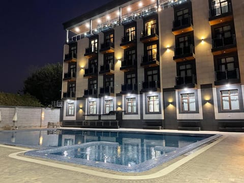 Property building, Night, Pool view, Swimming pool