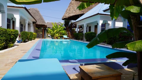 Property building, Patio, Day, Garden, Garden view, Pool view, Swimming pool, sunbed