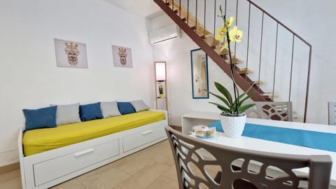 Bed, Living room, Seating area, Dining area