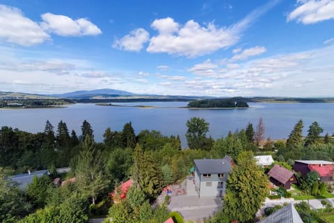 Property building, Nearby landmark, Day, Natural landscape, Bird's eye view, Lake view, Mountain view