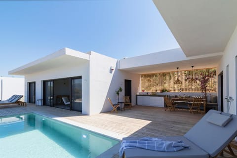 Property building, Seating area, Swimming pool, sunbed