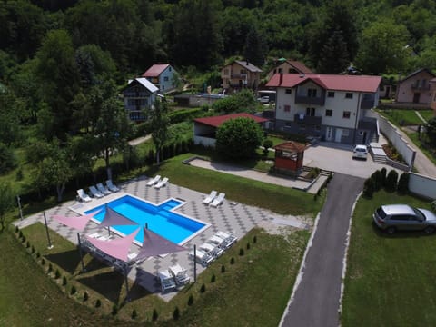 Property building, Natural landscape, Bird's eye view, Garden view, Swimming pool, Parking