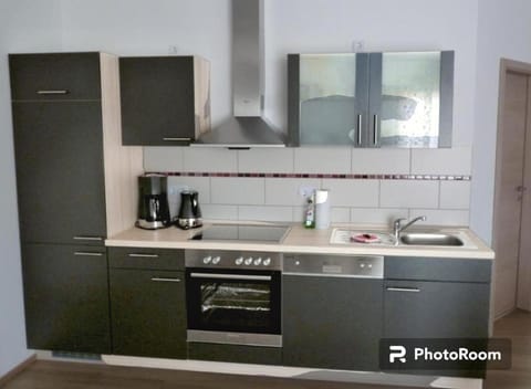 Kitchen or kitchenette, dishwasher, stove, toaster