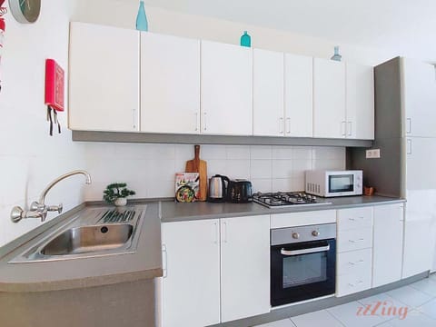 Kitchen or kitchenette, oven, stove, toaster