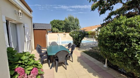 Property building, Patio, Day, Natural landscape, Dining area, Pool view, Swimming pool