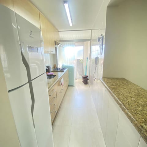 Kitchen or kitchenette, microwave, stove, laundry