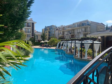 Property building, Day, Natural landscape, Pool view, Swimming pool, sunbed