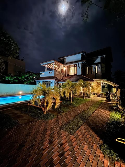 Property building, Patio, Night, Garden, Garden view, Pool view, Swimming pool