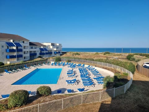 Property building, Natural landscape, Beach, Pool view, Sea view, Swimming pool, sunbed