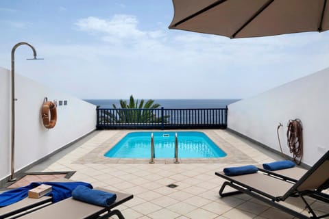 Property building, Living room, Swimming pool