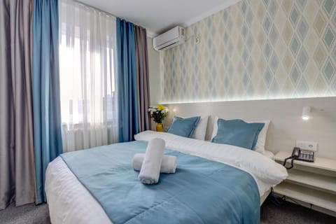 Bed, Photo of the whole room, Bedroom, towels, air conditioner