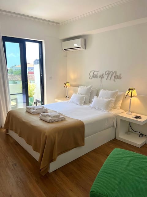 Bed, Photo of the whole room, Bedroom, towels, air conditioner