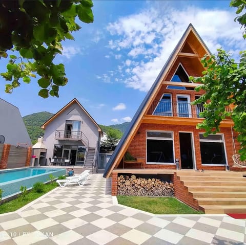 Property building, Day, Natural landscape, Pool view, Swimming pool