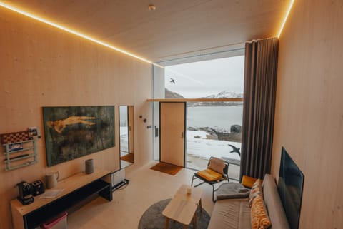 View (from property/room), Living room, Photo of the whole room, Seating area, Mountain view, Sea view