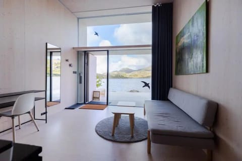 View (from property/room), Living room, Seating area, Mountain view, Sea view