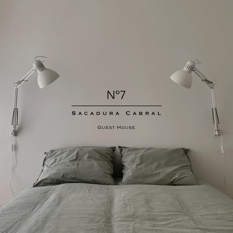 Bed, Property logo or sign, Bedroom
