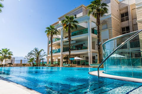Property building, Day, Pool view, Swimming pool, sunbed