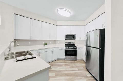 Kitchen or kitchenette, dishwasher, oven, stove