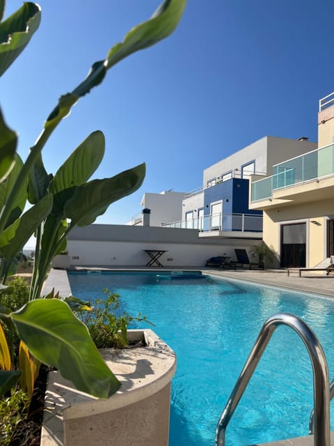 Property building, Day, Pool view, Swimming pool, sunbed