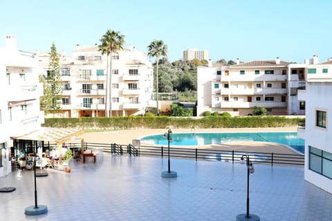 Property building, Spring, People, People, Summer, View (from property/room), On site, Pool view, Swimming pool, Seasons, Time of day, children, children, children, young children, young children, young children, older children, older children, older children, group of guests, group of guests, group of guests, Family, Family, Family