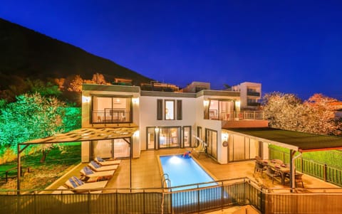 Property building, Patio, Night, Natural landscape, Mountain view, Pool view, Swimming pool, sunbed