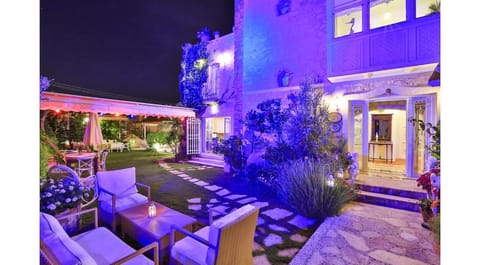 Property building, Patio, Night, Garden, Seating area