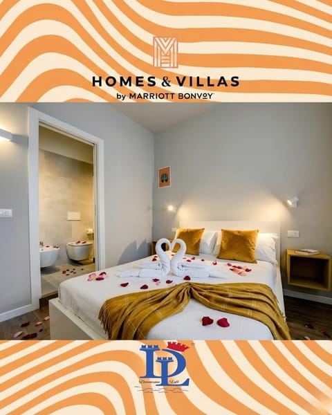 Bed, Property logo or sign, Photo of the whole room, Logo/Certificate/Sign, Bedroom, Text overlay, Certificate/Award, towels