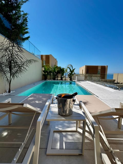 Patio, Day, Natural landscape, Pool view, Swimming pool, sunbed
