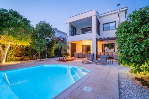 Property building, Patio, Night, Garden, Swimming pool, sunbed