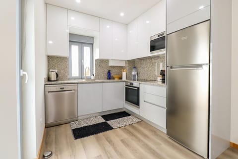 Kitchen or kitchenette, dishwasher, oven, stove, toaster