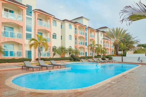 Property building, Natural landscape, Summer, Balcony/Terrace, Living room, Beach, Guests, Garden view, Pool view, Swimming pool, Location, Sunset, group of guests, group of guests, Family, Parking, furniture, internet, pet friendly, toaster, towels, laundry, kitchen, air conditioner