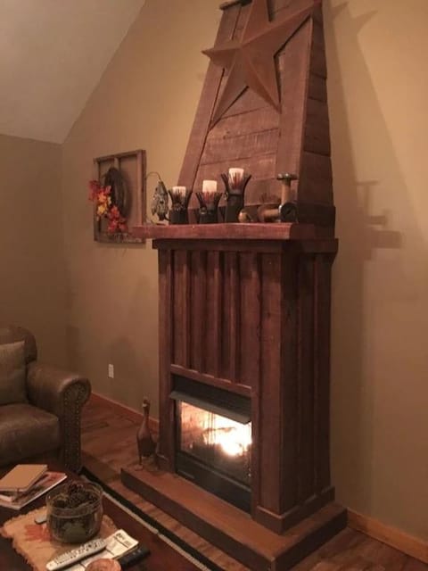 Gas fireplace, firepit, and cedar Adirondack chair House in Tennessee