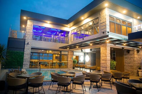 Patio, Restaurant/places to eat, Living room, Banquet/Function facilities, Seating area, Evening entertainment, Pool view, Swimming pool