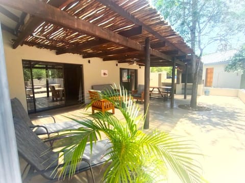 Property building, Patio, Dining area, Swimming pool