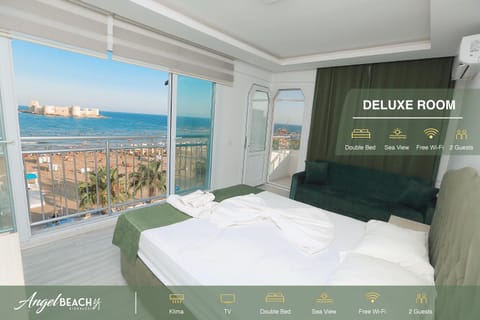 Bed, Photo of the whole room, Text overlay, Sea view